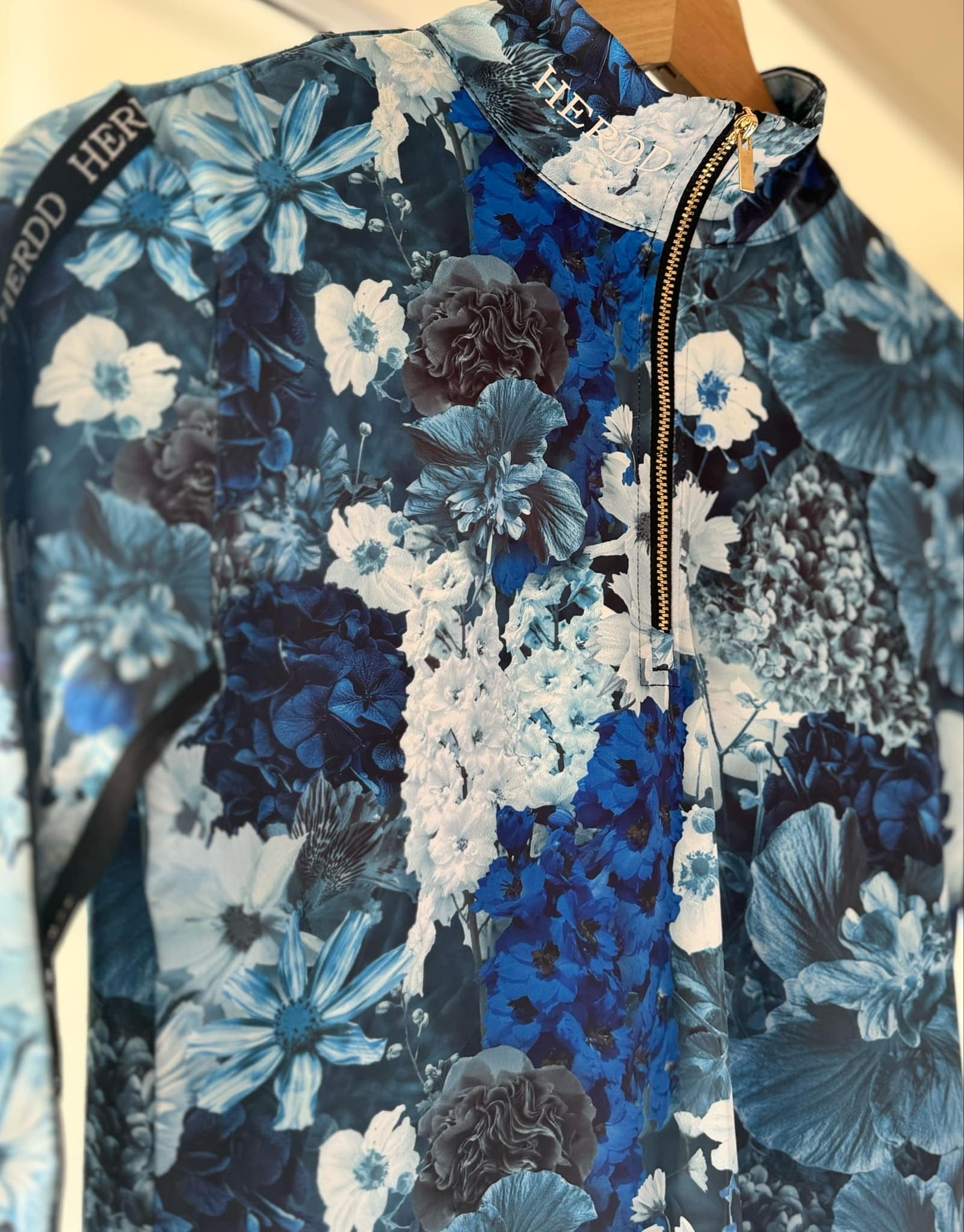 The HERDD Merch blue -out FLORAL base layer