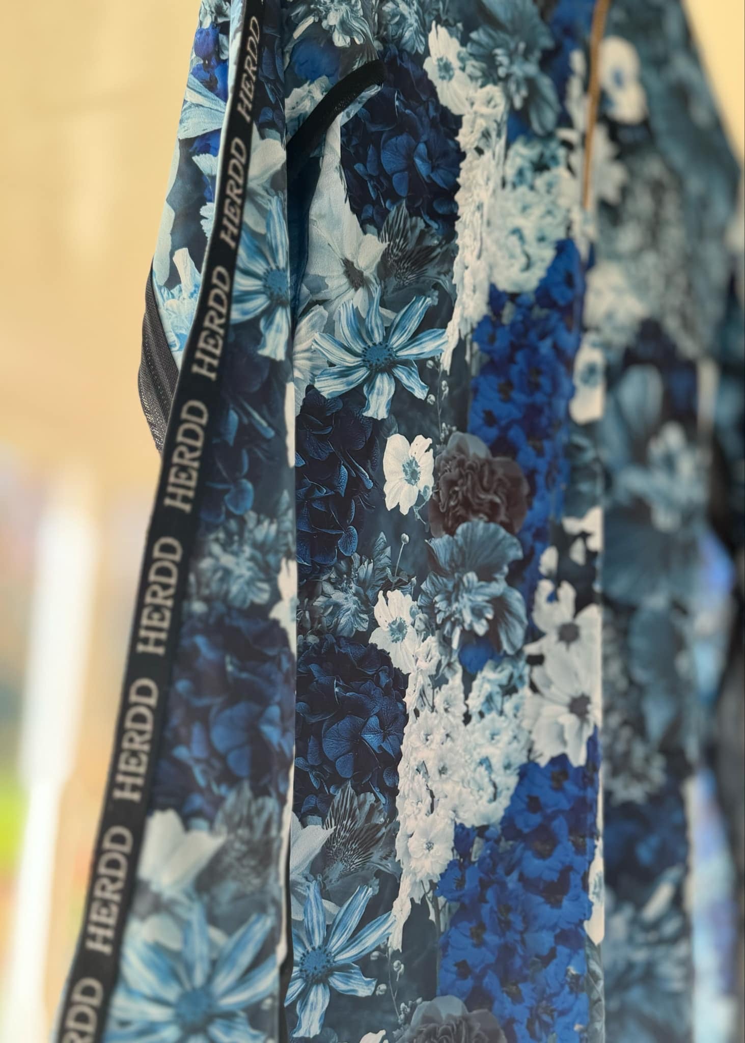 The HERDD Merch blue -out FLORAL base layer
